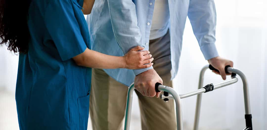 Close-up of the hands of a health volunteer next to those of an elderly woman. Concept of care. Aging concept. Volunteering concept.