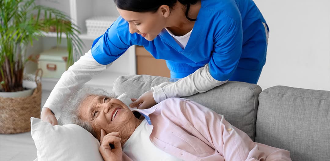 Close-up of the hands of a health volunteer next to those of an elderly woman. Concept of care. Aging concept. Volunteering concept.