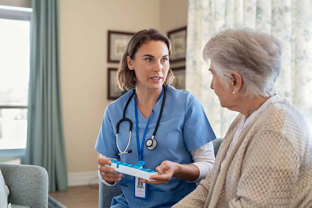 Close-up of the hands of a health volunteer next to those of an elderly woman. Concept of care. Aging concept. Volunteering concept.