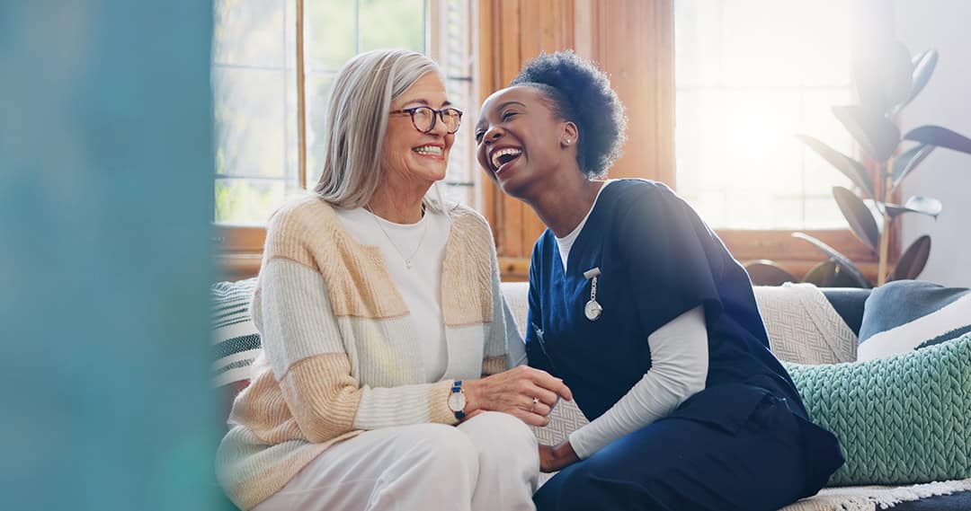 Close-up of the hands of a health volunteer next to those of an elderly woman. Concept of care. Aging concept. Volunteering concept.