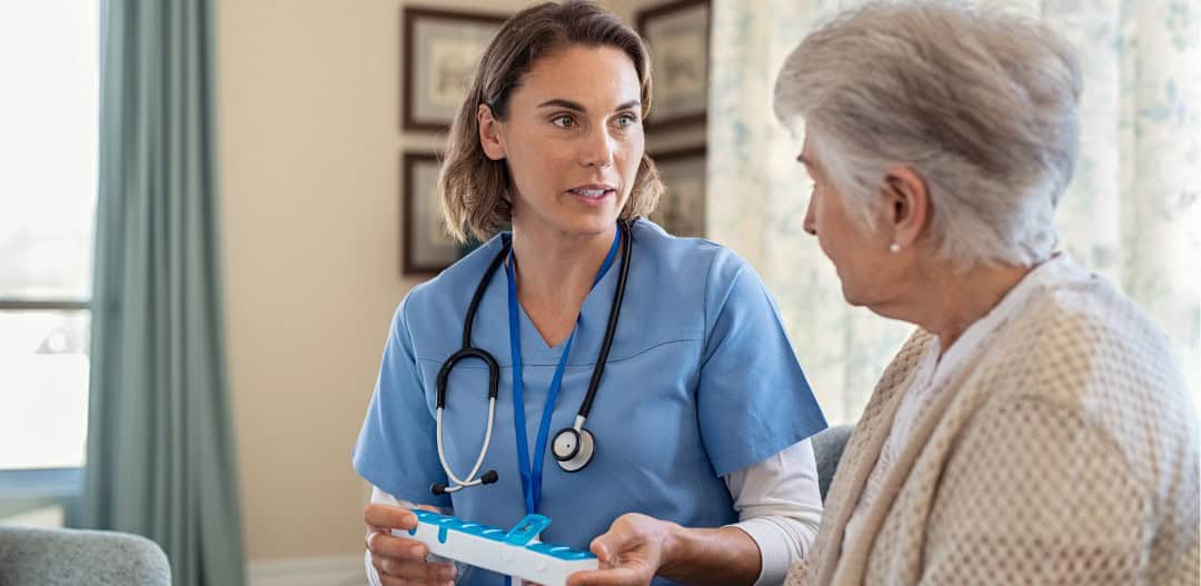 Close-up of the hands of a health volunteer next to those of an elderly woman. Concept of care. Aging concept. Volunteering concept.