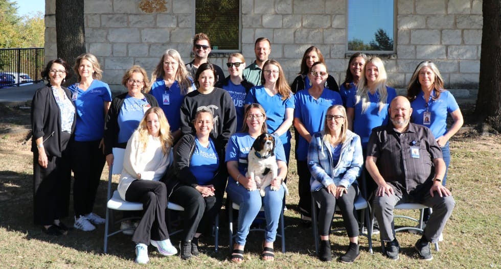 Close-up of the hands of a health volunteer next to those of an elderly woman. Concept of care. Aging concept. Volunteering concept.